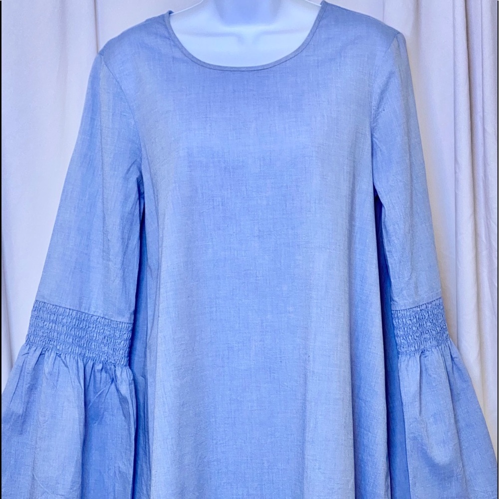 Bell sleeve cotton Blouse in light blue denim color.